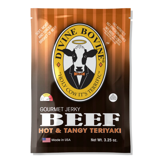 Divine Bovine Hot & Tangy Teriyaki Beef Jerky front: orange and brown bag, halo cow logo, heat gauge set to hot, no window