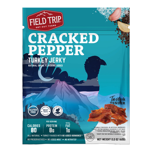 Field Trip Cracked Pepper Turkey Jerky bag front, mountain art and a printed photo of pepper-flecked jerky strips, no window