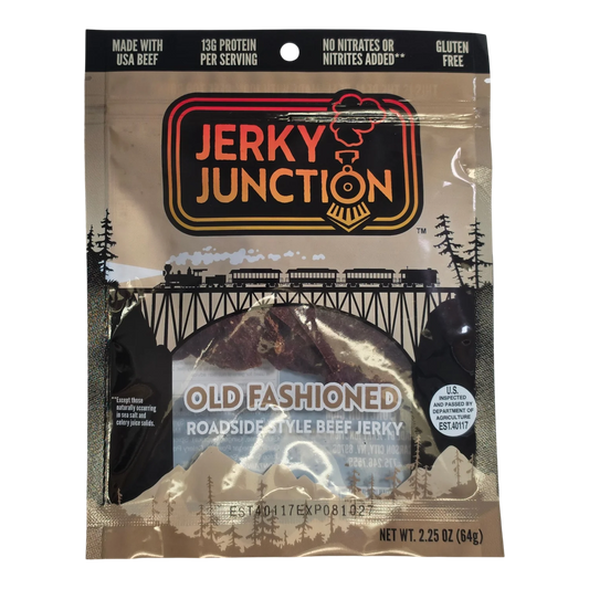 Jerky Junction Old Fashioned Roadside Style beef jerky front, tan bag with train and window showing dark reddish-brown pieces