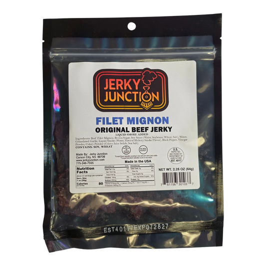 Jerky Junction Filet Mignon Original beef jerky front, black bag with window showing dark reddish-brown jerky pieces