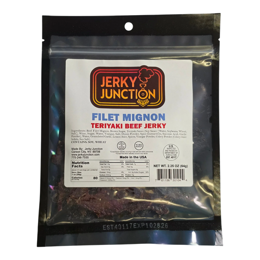 Jerky Junction Filet Mignon Teriyaki Beef Jerky front, black bag with window showing dark reddish-brown jerky pieces