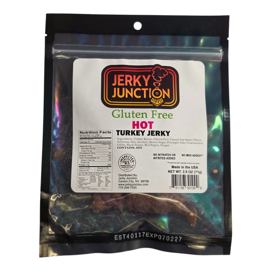 Jerky Junction Hot Turkey Jerky front, black bag with window showing dark reddish-brown turkey jerky pieces flecked with red