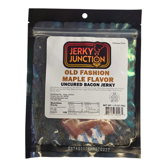 Jerky Junction Old Fashion Maple Flavor uncured bacon jerky front, iridescent bag, window showing reddish-brown bacon strips
