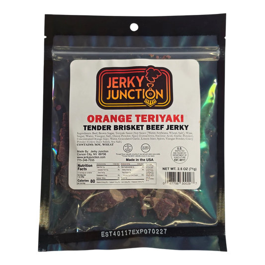 Jerky Junction Orange Teriyaki beef jerky front, clear bag with white label showing dark reddish-brown brisket pieces