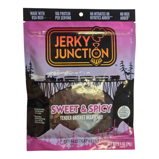 Jerky Junction Sweet & Spicy brisket beef jerky front, pink bag with window showing dark brown jerky pieces with red flecks
