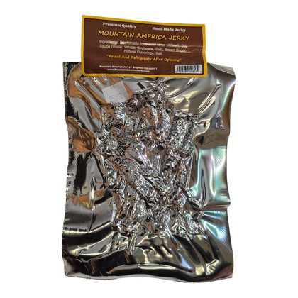 Mountain America Jerky Garlic Pepper Beef Jerky back: silver bag, brown label with ingredients