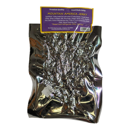 Mountain America Jerky Spicy Turkey Jerky back: purple label with ingredients, reseal