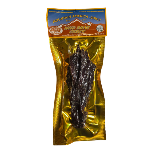 Mountain America Jerky Wild Boar Jerky front: gold bag, boar and mountain label, dark jerky strips visible in the window