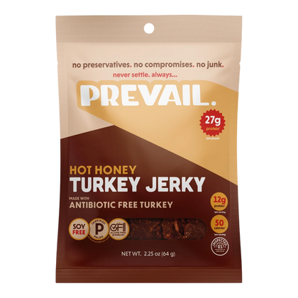 PREVAIL Jerky Hot Honey Turkey Jerky front, tan and brown bag with window showing dark reddish-brown jerky pieces