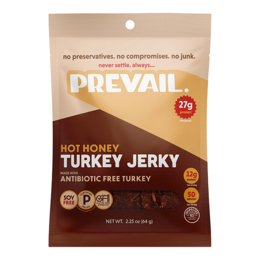 PREVAIL Jerky Hot Honey Turkey Jerky front, tan and brown bag with window showing dark reddish-brown jerky pieces