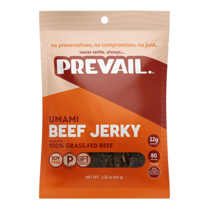 Front of orange and cream PREVAIL Umami Beef Jerky bag, dark brown jerky pieces visible through the window