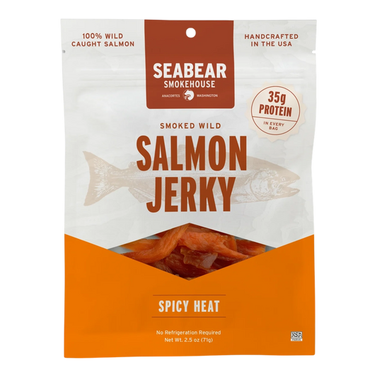 SeaBear Smokehouse Spicy Heat Smoked Wild Salmon Jerky pouch, front, with orange salmon jerky strips visible in the window