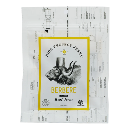Side Project Jerky Berbere Flavor Beef Jerky bag front, yellow-bordered label, top-hat buffalo, Gluten-Free badge