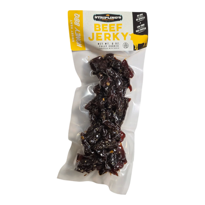 Stripling’s Sweet Heat Honey BBQ beef jerky front, clear bag showing dark reddish-brown pieces, No MSG No Nitrites badge