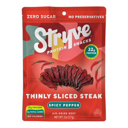 Front of Stryve Spicy Pepper Thinly Sliced Steak bag: air-dried beef with a photo of red sliced beef and chili peppers.