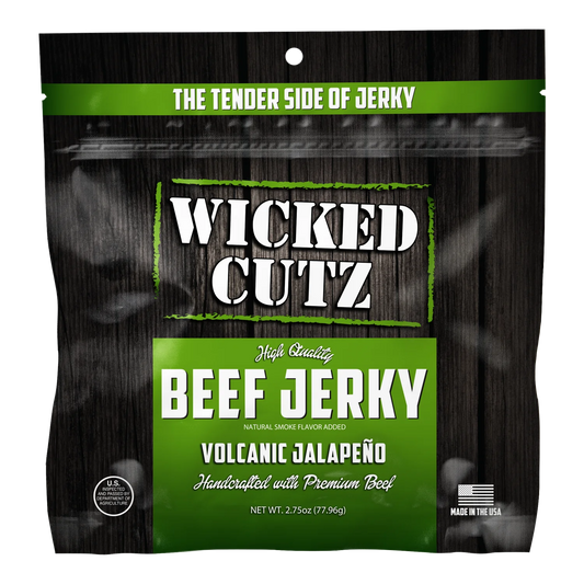 Wicked Cutz Volcanic Jalapeño beef jerky front, black woodgrain bag with green panel, no window, Made in the USA badge